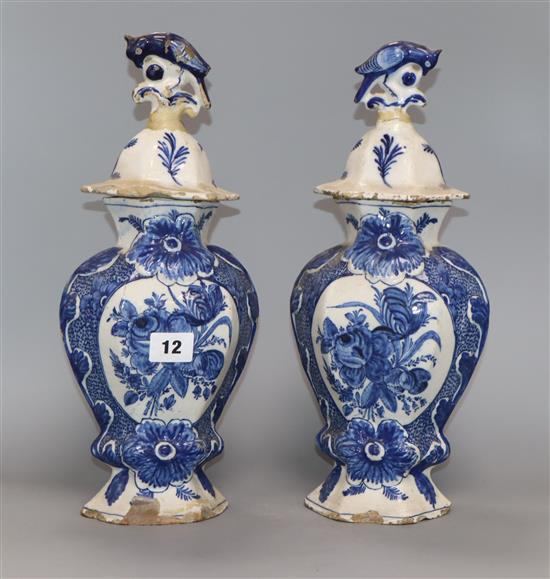 A pair of late 18th century Dutch delft lidded vases and covers (a.f.) height 35cm